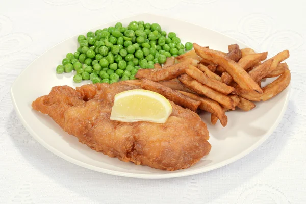 Fried fish with slice of lemon — Stock Photo, Image