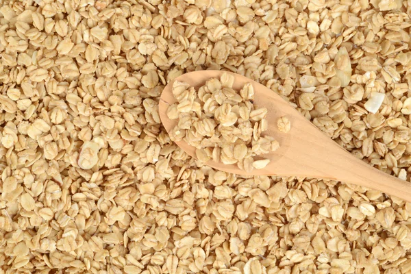 Fondo di granola con cucchiaio di legno — Foto Stock