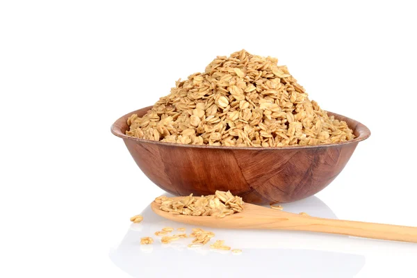 Bowl of granola with wood spoon — Stock Photo, Image