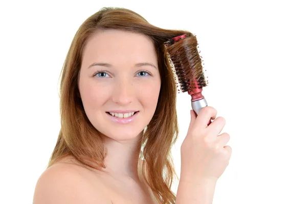 Teen girl curling her hair — Stock Photo, Image