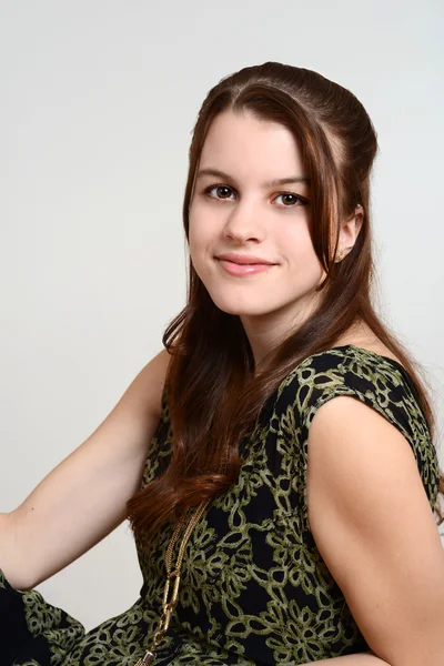 Portrait teen brunette girl sitting — Stock Photo, Image