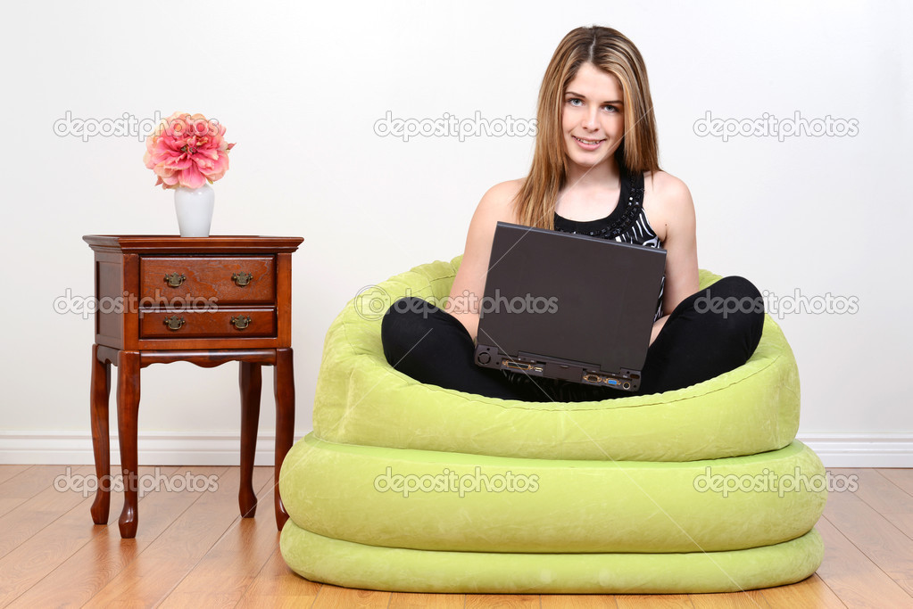 female teen with laptop computer