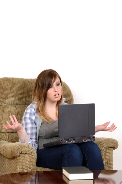 Upset teen girl with laptop and copy space — Stock Photo, Image