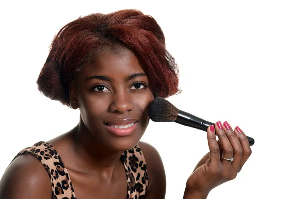 Young black woman putting on blush makeup — Stock Photo, Image