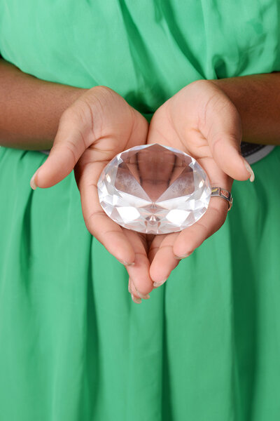 Black woman holding large diamond