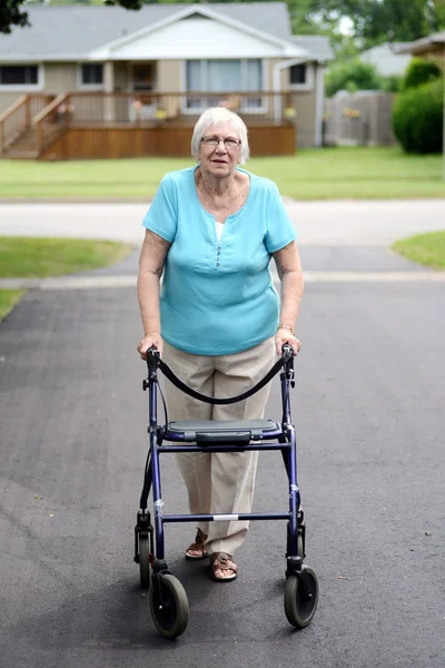 Senior woman with walker — Stock Photo, Image