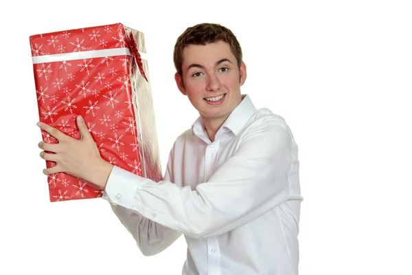 Menino adolescente com grande presente de Natal — Fotografia de Stock