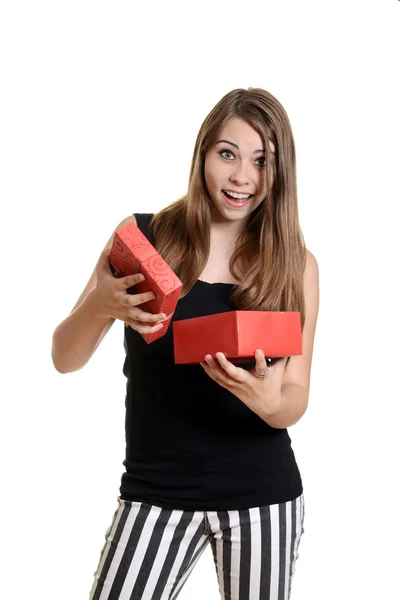 Excited teen girl with christmas present — Stock Photo, Image