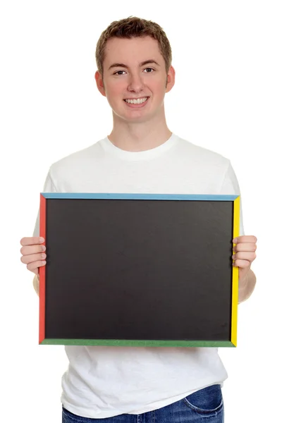 Teen boy holding chalk board — Stock Photo, Image