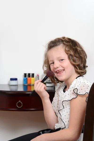 Happy little girl with blush brush — Stock Photo, Image