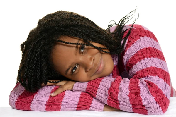 Young black child with head on arms — Stock Photo, Image