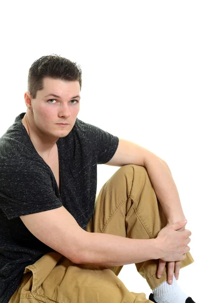 Attractive young man sitting — Stock Photo, Image