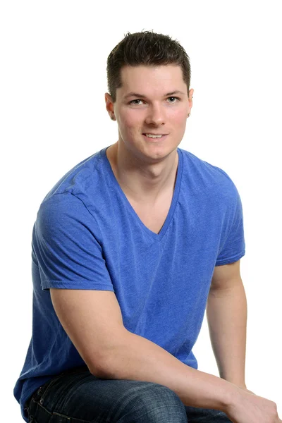 Young muscular man sitting — Stock Photo, Image
