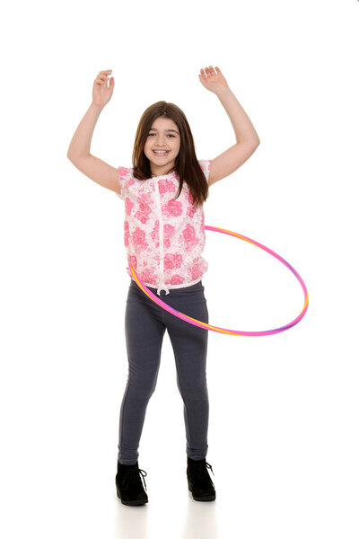 Child playing with hula hoop
