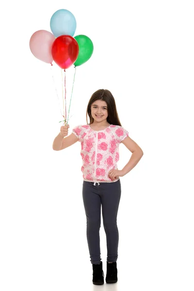 Ragazzina con palloncini in mano — Foto Stock