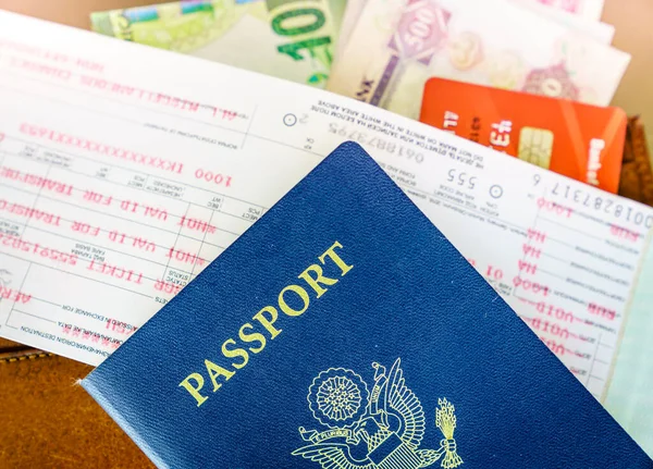 Travel essentials: passport, airline tickets and money