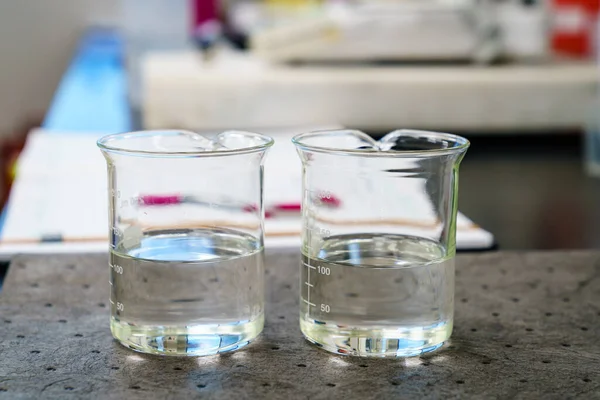 Two Beakers Clear Liquids Pad Laboratory — Fotografia de Stock