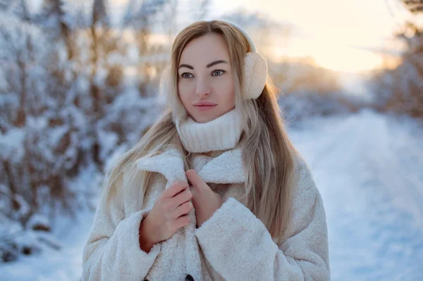 Beautiful woman in fur headphones. winter girl . — 图库照片