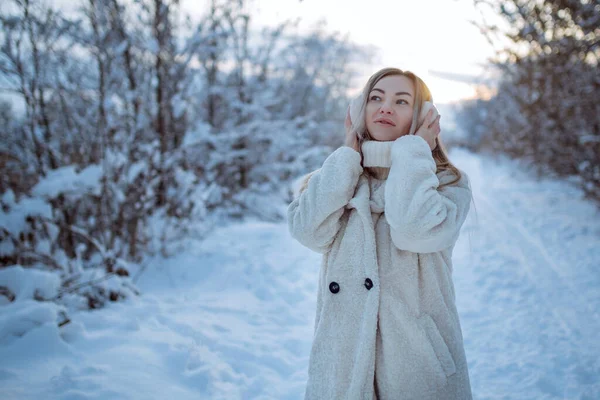 Beautiful woman in fur headphones. winter girl . — Foto Stock