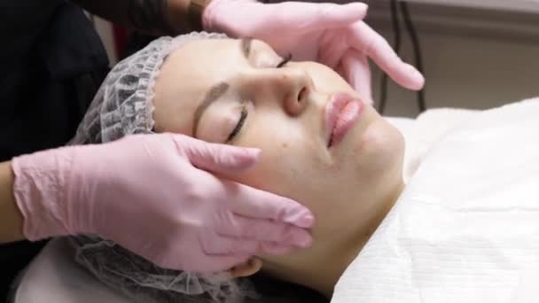 Facial rejuvenation treatment with cream at the spa — Stock Video