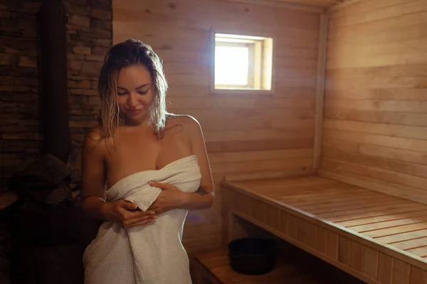 Young Woman Relaxes Sweats Hot Sauna Wrapped Towel Girl Sauna — Stock Photo, Image