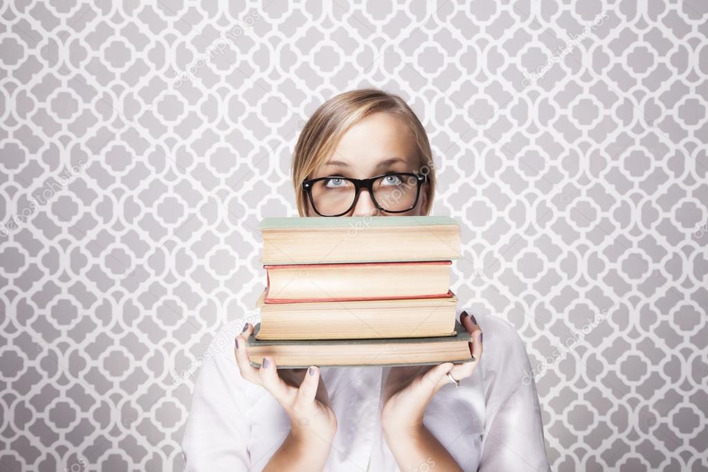 Woman Peering Over Books