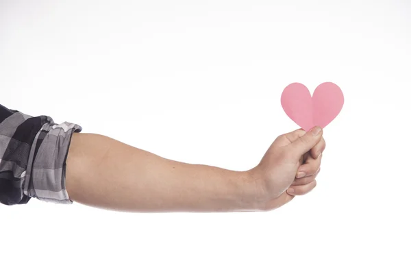 Brazo que sostiene el corazón de papel —  Fotos de Stock