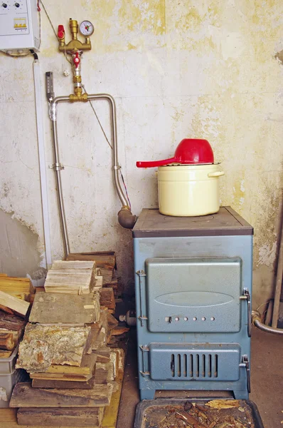 Steel water boiler with a stove plate — Stock Photo, Image