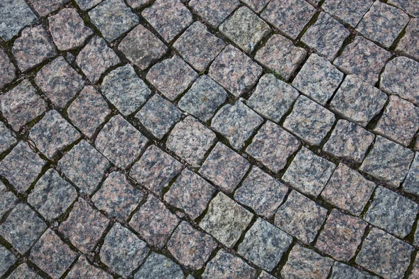 Pavimentación de piedra en el camino — Foto de Stock