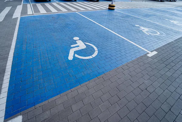 Handicapped symbol painted on a special parking space for disabled people — Stock Photo, Image