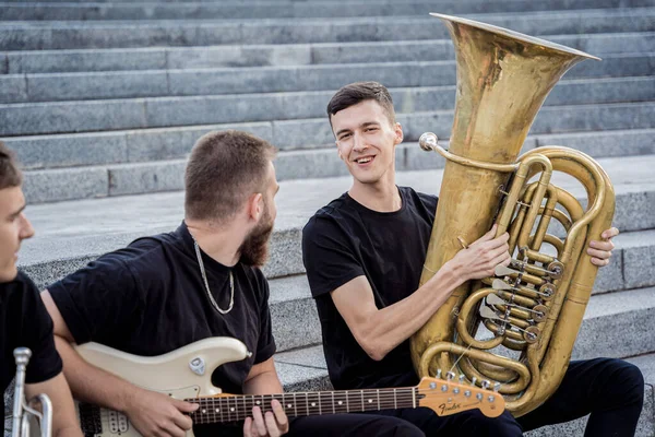 Young street music band play a lot of musical instruments — Stock Photo, Image