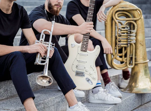 Young street music band play a lot of musical instruments — Stock Photo, Image