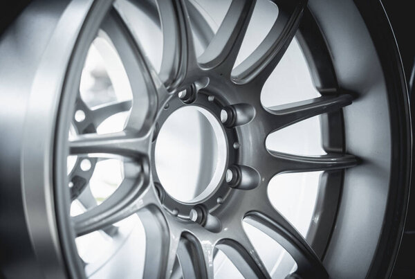 Car metal disc at the black background