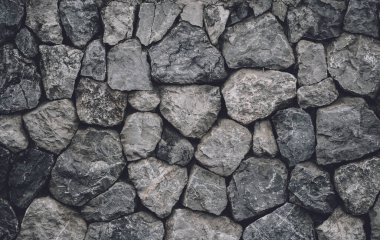 Background and texture of old stoned wall