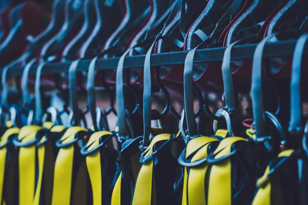 Rows of climbing safety ropes and carabiners and helmets — Foto de Stock