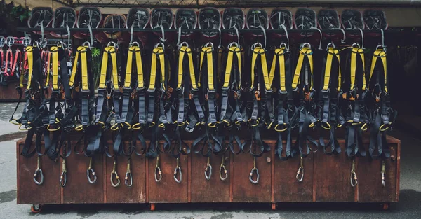 Rows of climbing safety ropes and carabiners and helmets — 스톡 사진