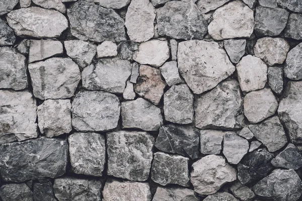 Tło i tekstura starej ściany kamiennej — Zdjęcie stockowe