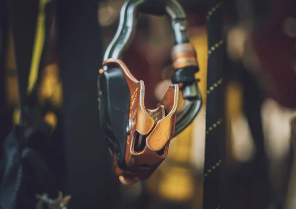 Rows of climbing safety ropes and carabiners and helmets — Stockfoto