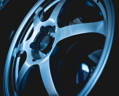 Car metal disc at the black background