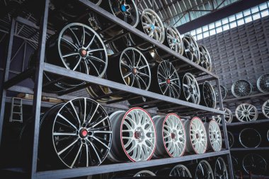 Rows of metal car disks in a shop.