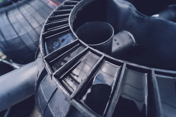 black plastic water storage tanks at the manufacturer factory depot.