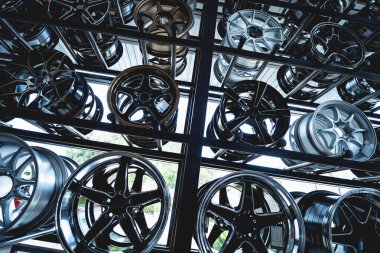 Rows of metal car disks in a shop.