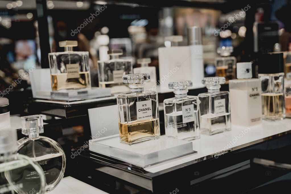 PHUKET, THAILAND - MAY 29, 2022: A rows of Chanel brand perfumes in a case on the supermarket showcase.