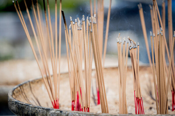 Ritual of burning incense sticks at the big Thai temple.