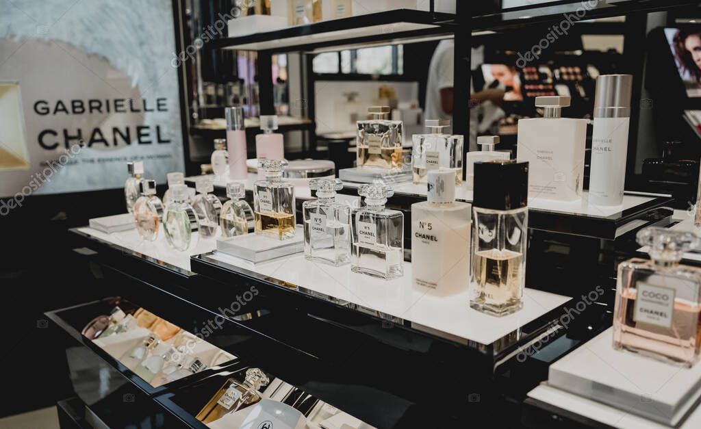 PHUKET, THAILAND - MAY 29, 2022: A rows of Chanel brand perfumes in a case on the supermarket showcase.