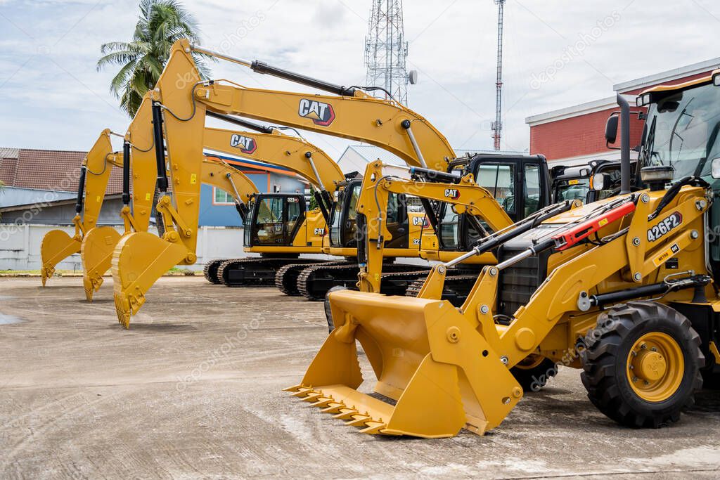 PHUKET, TAHAILAND - JUNE 05, 2022: Caterpillar heavy duty equipment vehicle on display area of dealership.