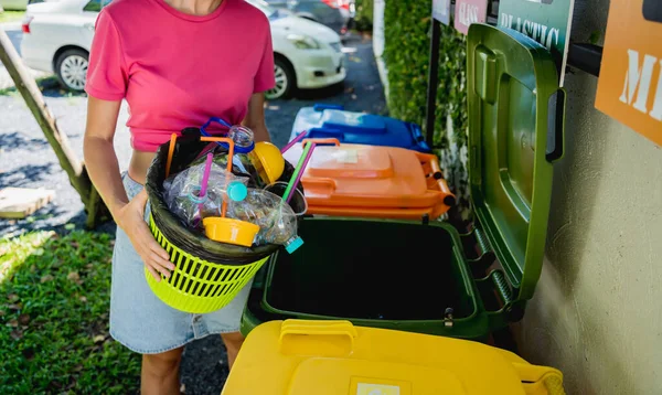 Young Beautiful Girl Throws Sorted Garbage Special Bins — стоковое фото