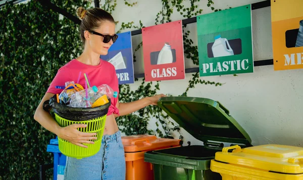 Young Beautiful Girl Throws Sorted Garbage Special Bins — стоковое фото