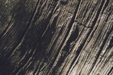 Eski taşlaşmış duvarın arka planı ve dokusu.