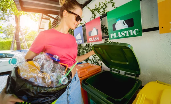 Young Beautiful Girl Throws Sorted Garbage Special Bins — стоковое фото